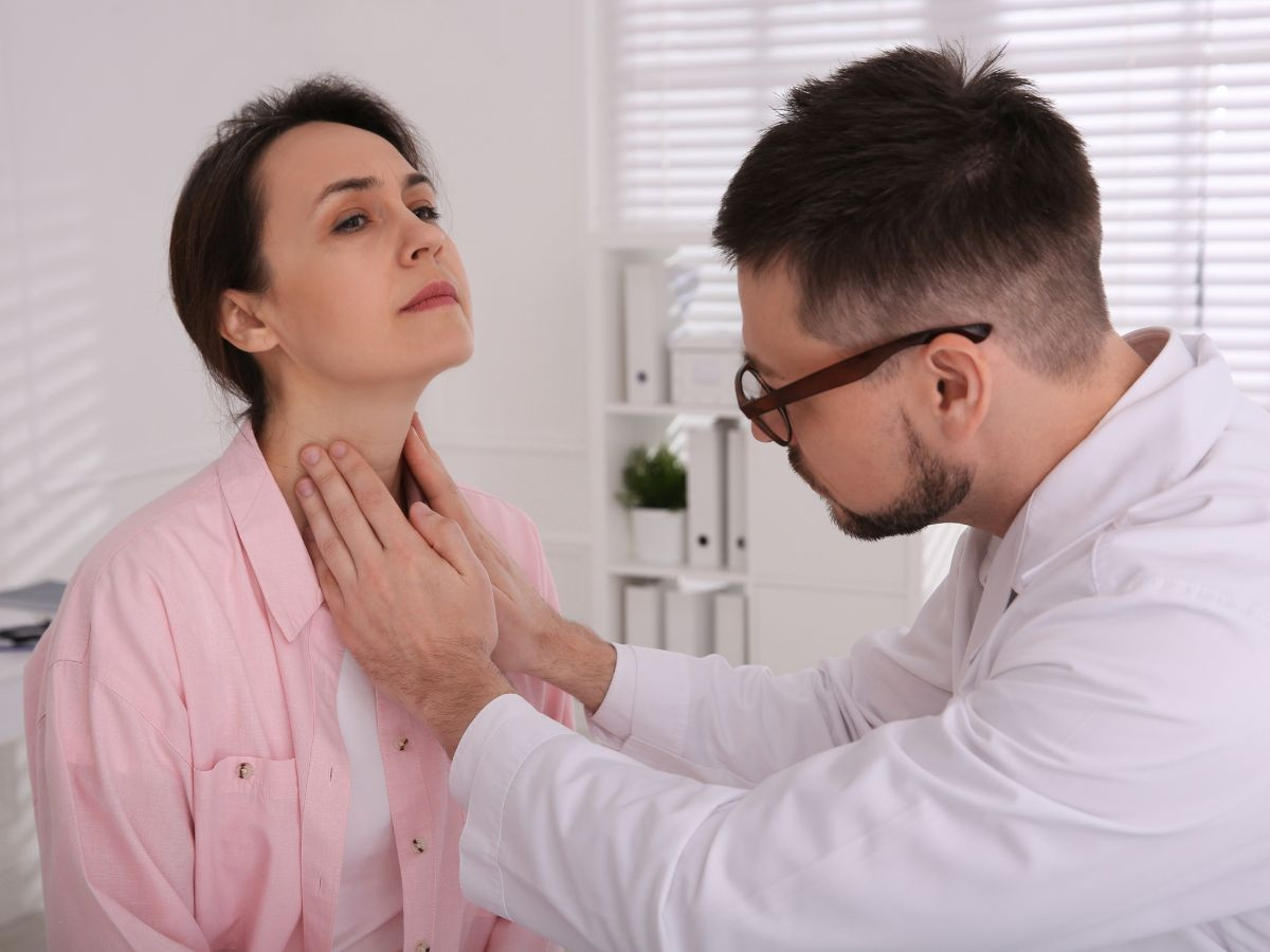 Doctor Checking thyroid