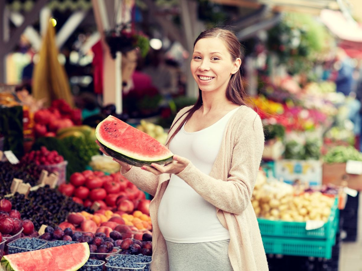 Pregnant eating watermelon