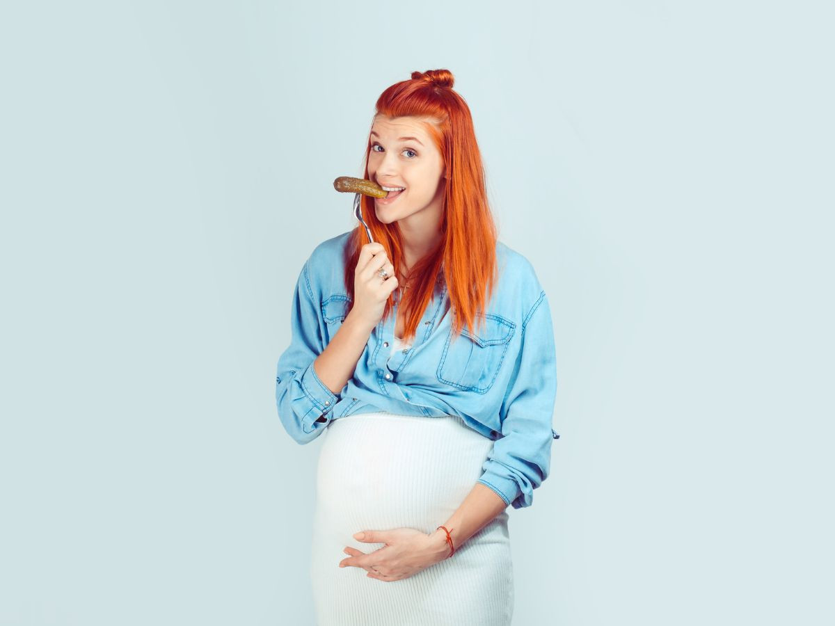 Pregnant Woman Eating Cucumber