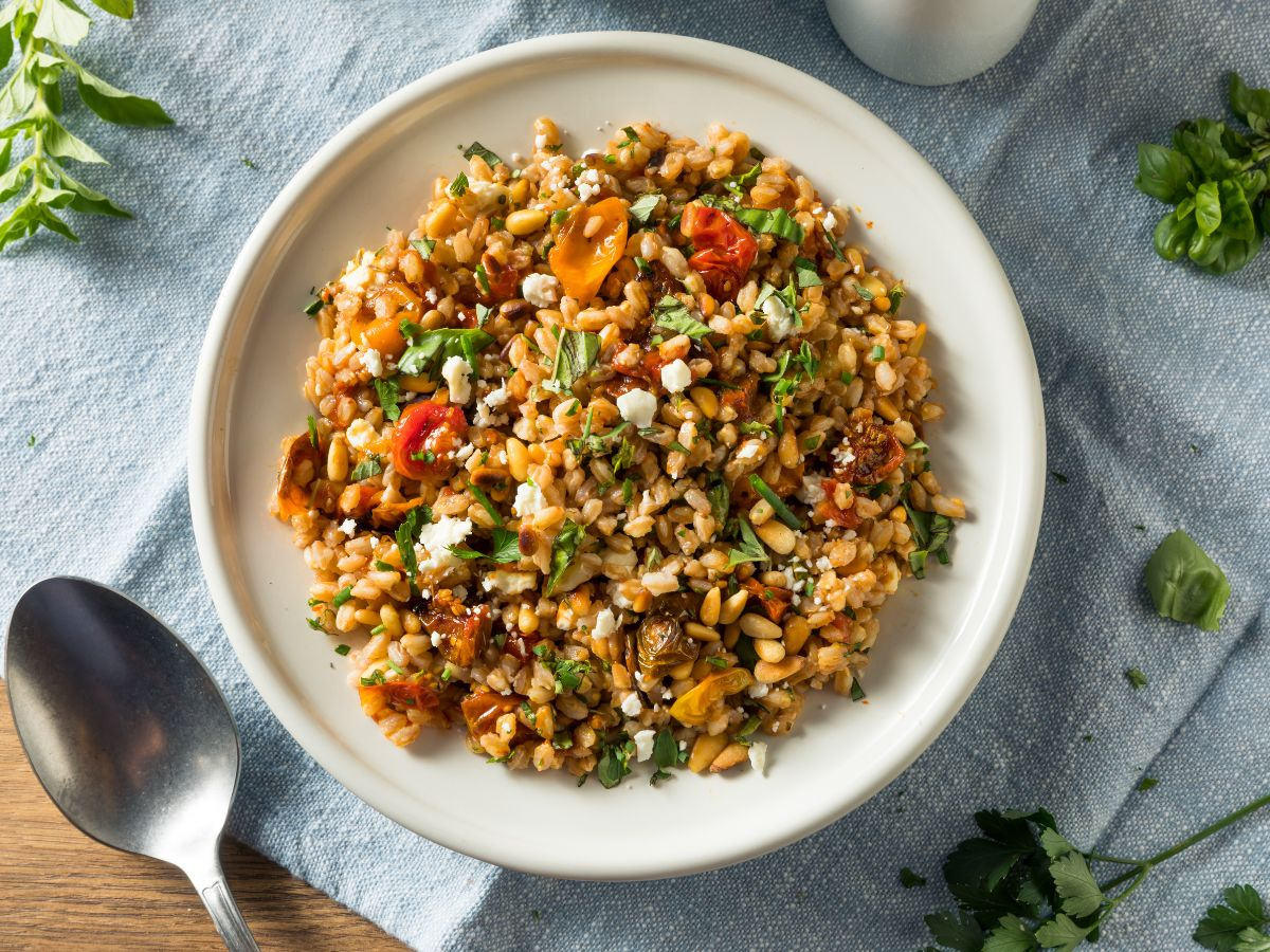 A bowl of farro salad with feta cheese